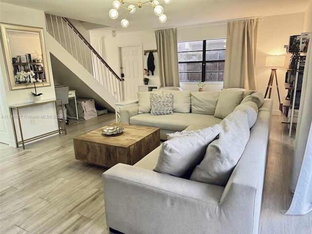 living room with hardwood / wood-style flooring and a chandelier