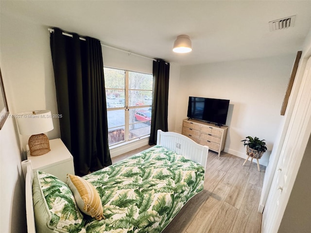 bedroom featuring light hardwood / wood-style floors