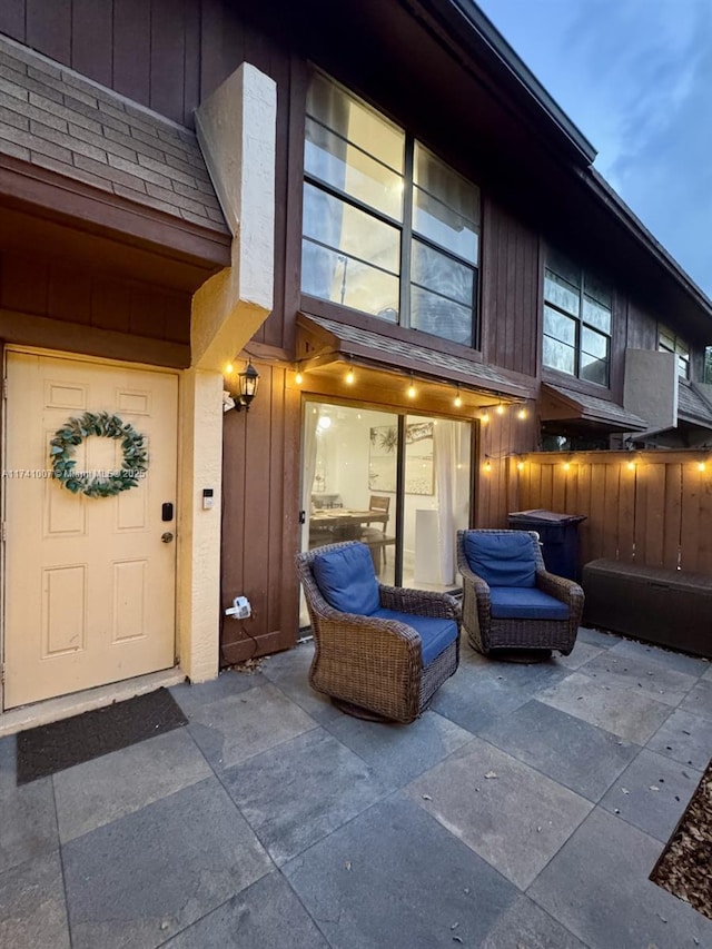 entrance to property with a patio