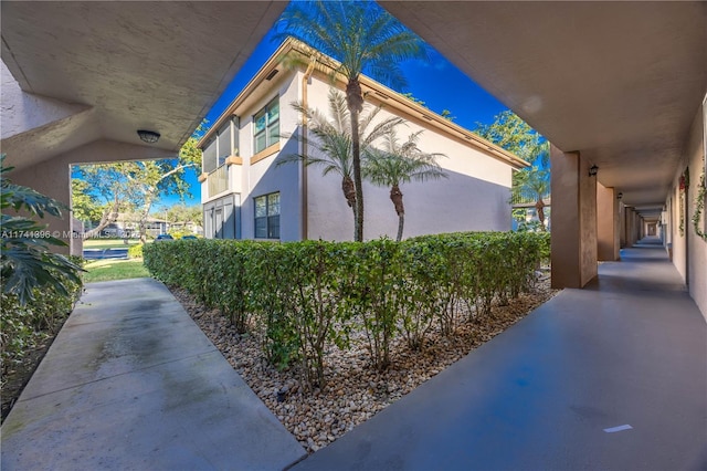 view of side of property with stucco siding