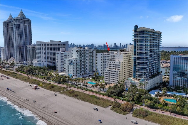 view of city featuring a water view and a view of the beach