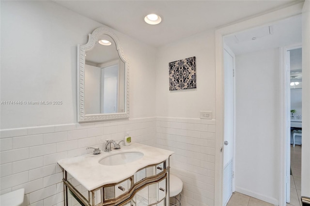 bathroom featuring tile walls, sink, and tile patterned floors