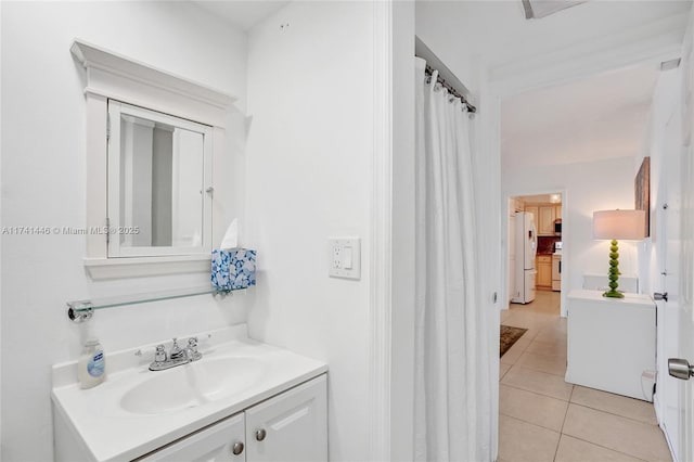 bathroom featuring vanity and tile patterned flooring