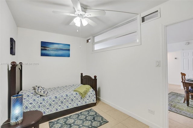 tiled bedroom with ceiling fan