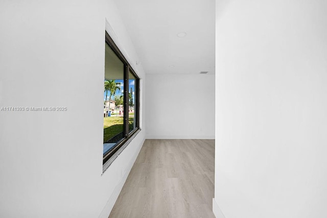 hall with light hardwood / wood-style floors