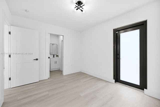 spare room featuring light hardwood / wood-style floors