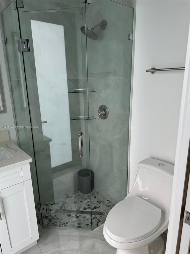 bathroom with vanity, toilet, and walk in shower