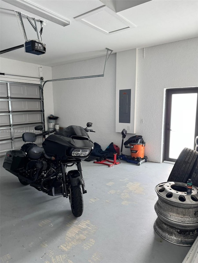 garage featuring a garage door opener and electric panel