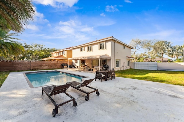 view of pool featuring a lawn and a patio