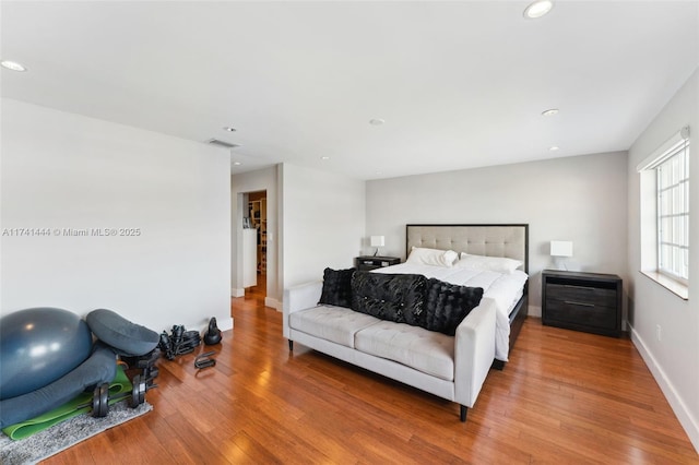 bedroom with hardwood / wood-style floors