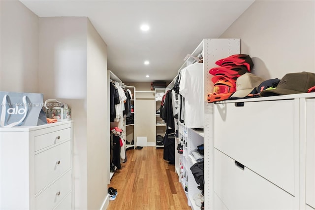 walk in closet featuring light hardwood / wood-style floors