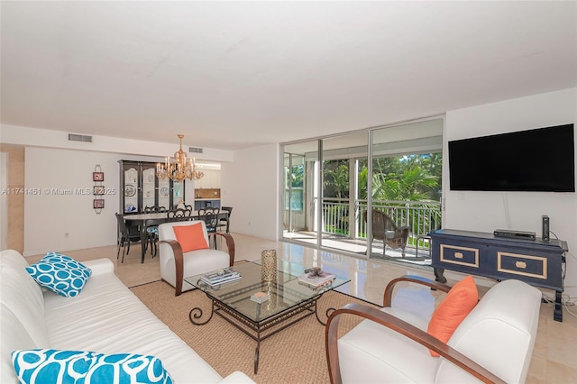 living room with a wall of windows and a chandelier