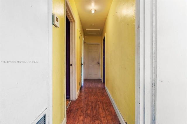 corridor featuring dark hardwood / wood-style flooring