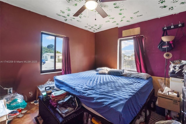 bedroom featuring multiple windows and tile patterned floors