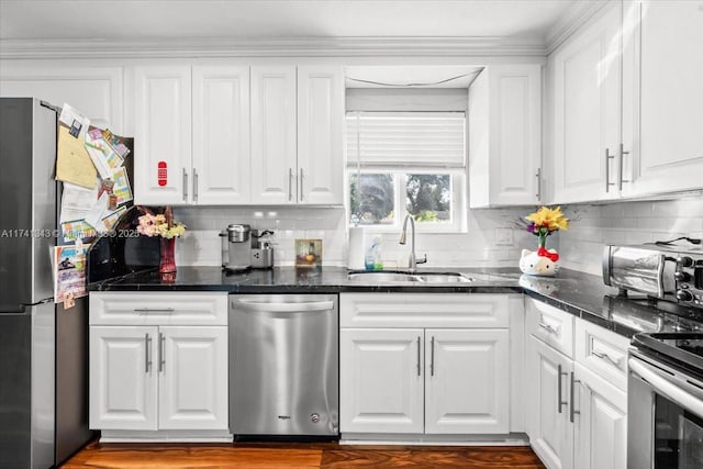 kitchen with white cabinetry, appliances with stainless steel finishes, and sink