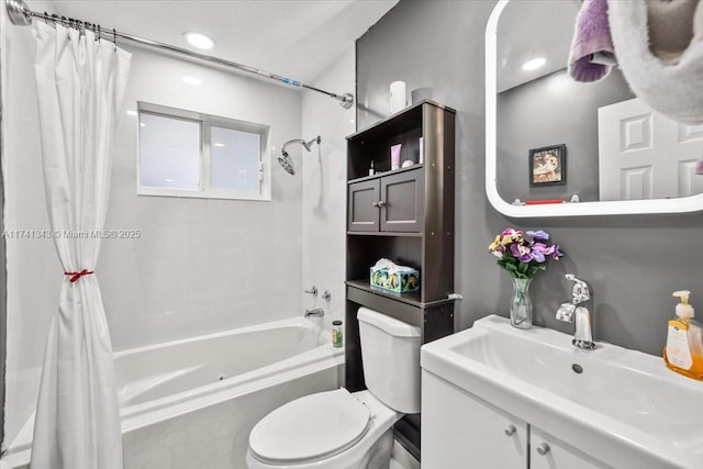 full bathroom featuring toilet, vanity, and shower / bathtub combination with curtain