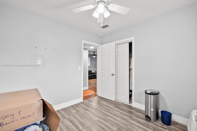 interior space with ceiling fan and light wood-type flooring