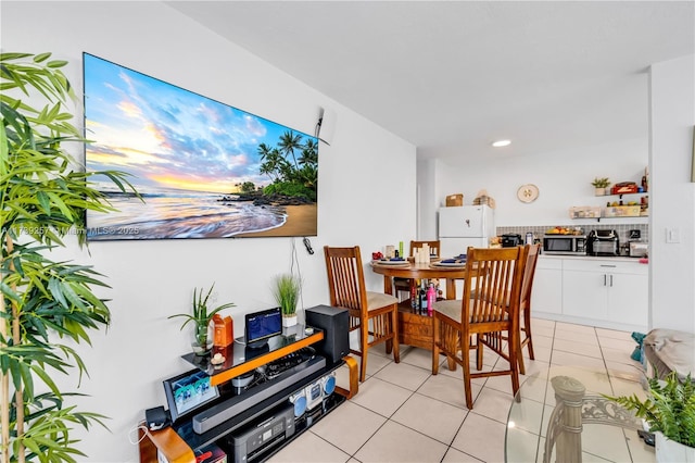 dining space featuring light tile patterned flooring