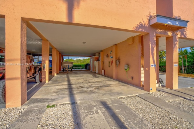 exterior space with a carport