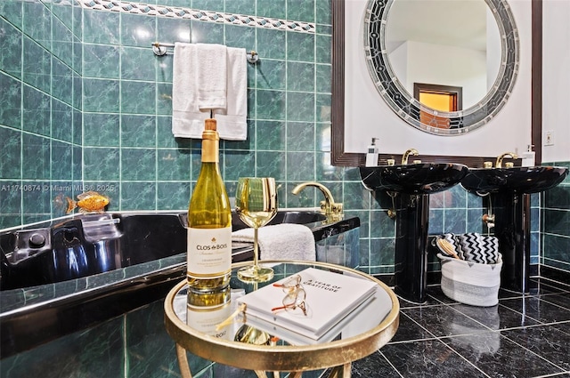 bathroom with sink and tile walls