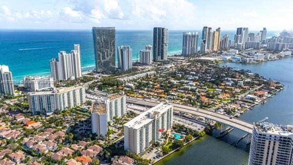 birds eye view of property with a water view