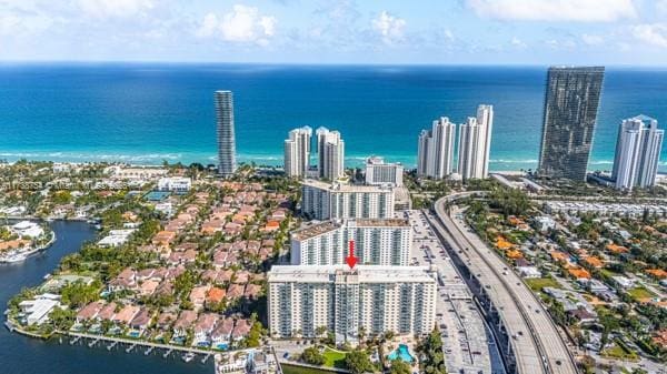 birds eye view of property with a water view