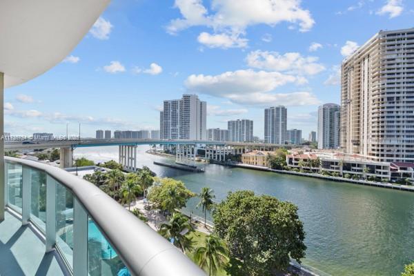 balcony featuring a water view