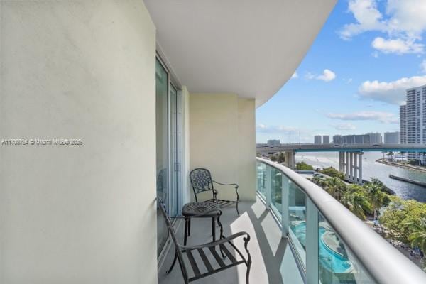 balcony featuring a water view