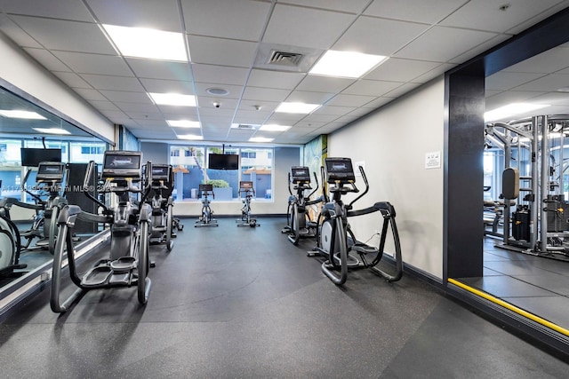 gym featuring a drop ceiling