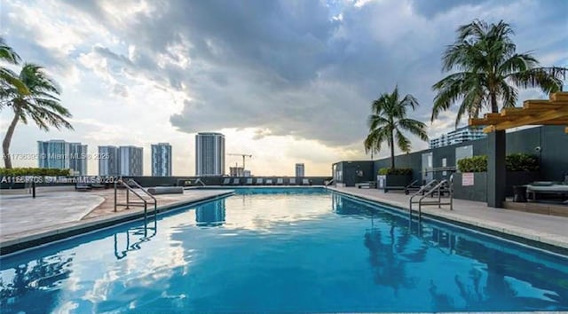 view of swimming pool with a patio area