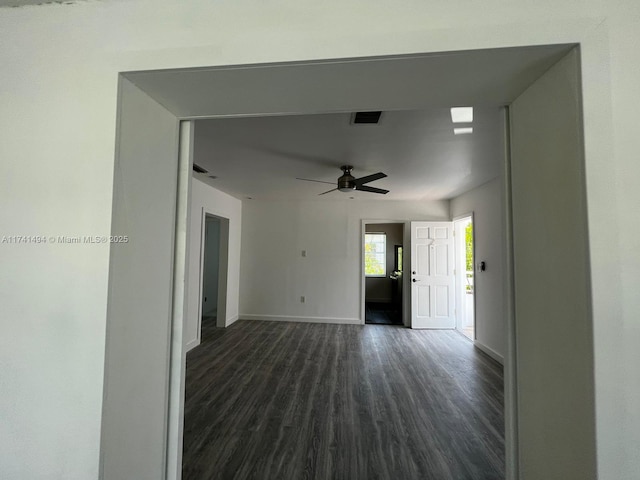 interior space with dark hardwood / wood-style floors and ceiling fan