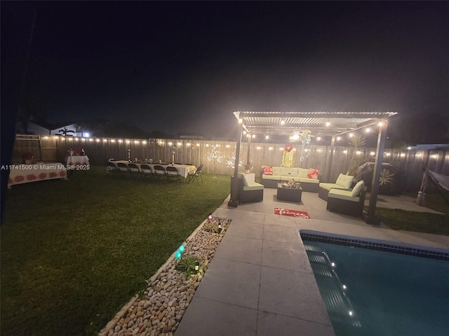 yard at night featuring a fenced in pool, an outdoor hangout area, a patio area, and a pergola