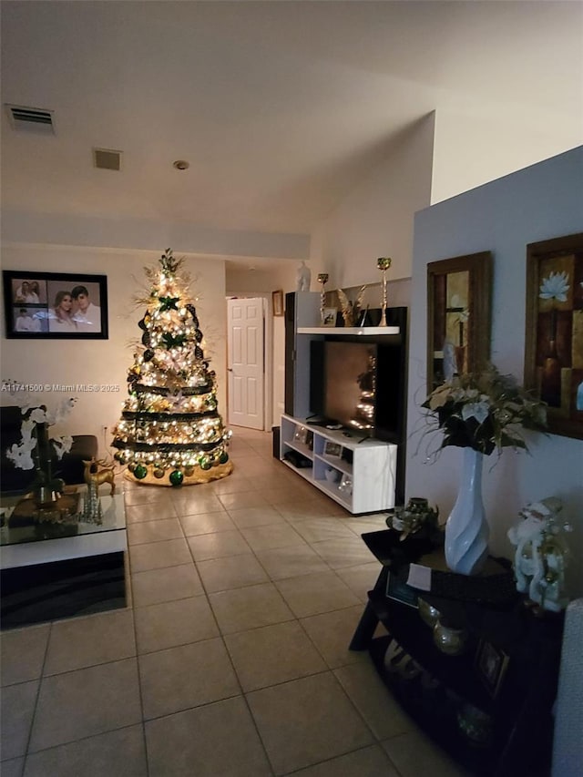 tiled living room featuring lofted ceiling