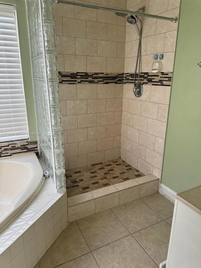 bathroom with tile patterned flooring and plus walk in shower