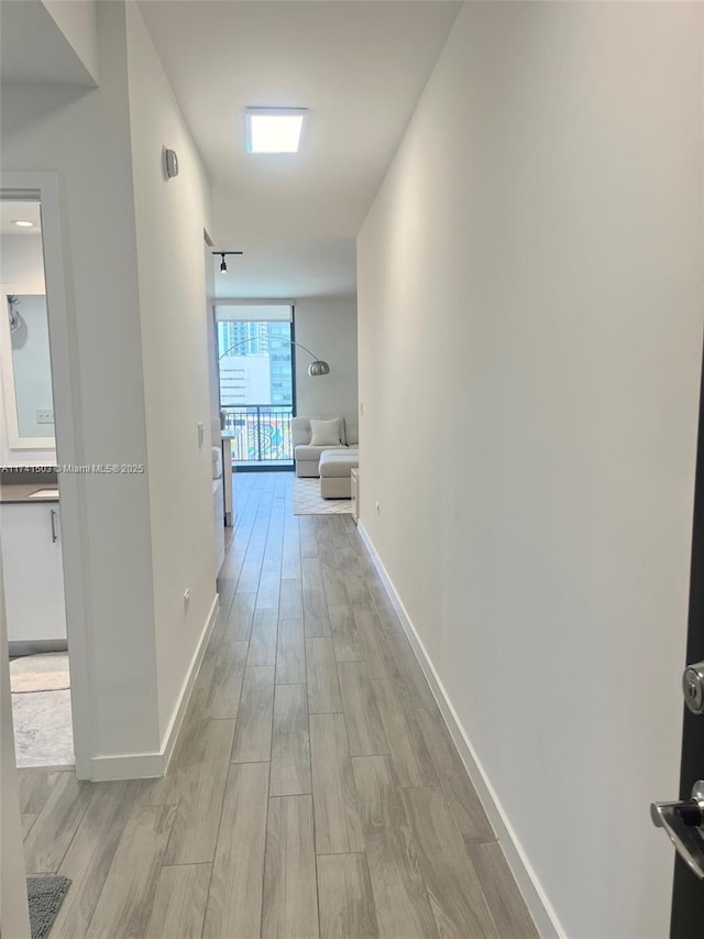 hallway featuring light hardwood / wood-style floors