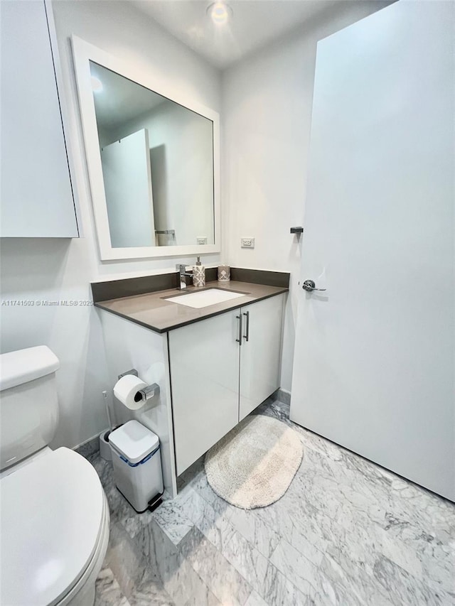 bathroom with vanity and toilet