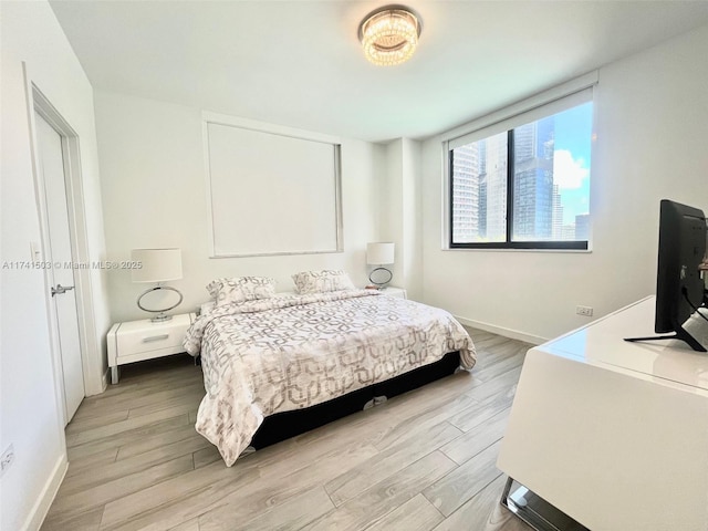 bedroom with light hardwood / wood-style flooring