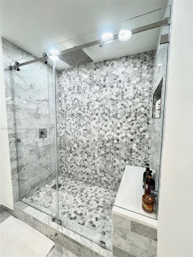 bathroom with tiled shower