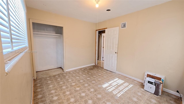 unfurnished bedroom featuring a closet