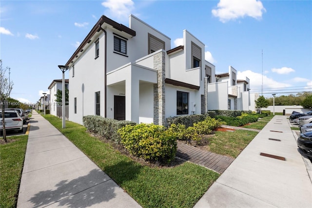 view of property exterior featuring a lawn