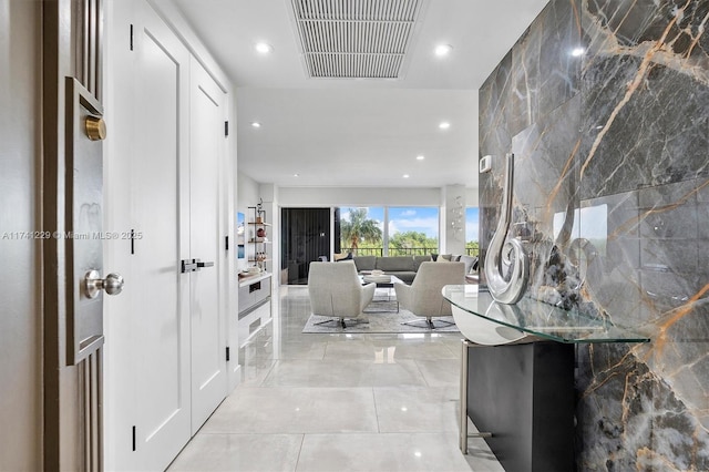 hallway with light tile patterned flooring