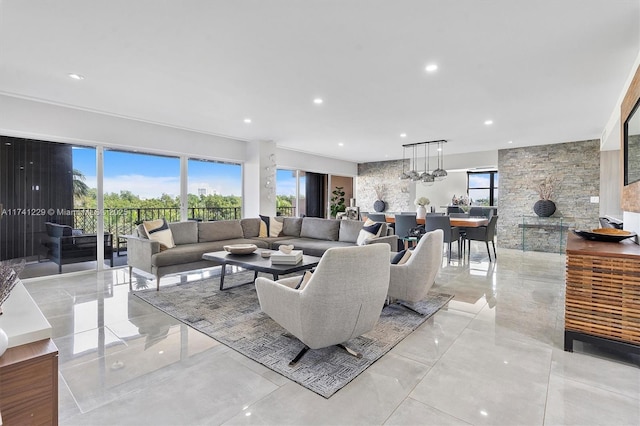 living room featuring an inviting chandelier and plenty of natural light