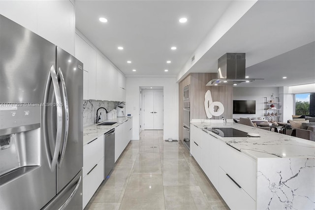 kitchen with stainless steel appliances, sink, and white cabinets