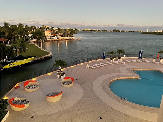 exterior space featuring a water view and a patio