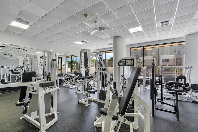workout area featuring a drop ceiling