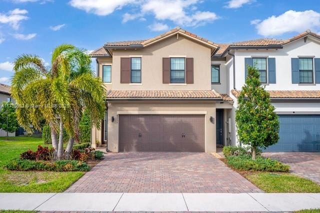 mediterranean / spanish-style home featuring a garage