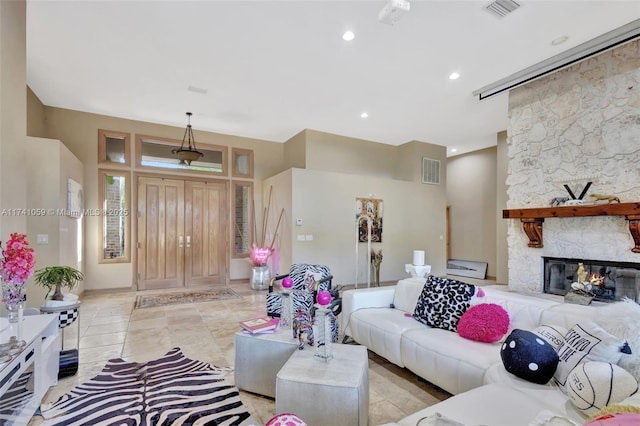 tiled living room with a fireplace