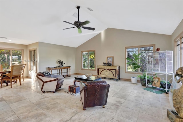 living room with lofted ceiling, light tile patterned flooring, and ceiling fan