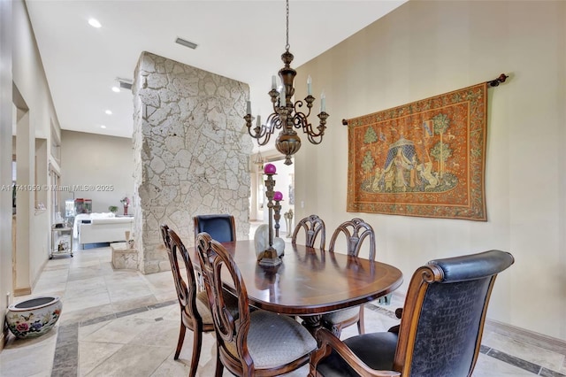 dining space featuring a chandelier