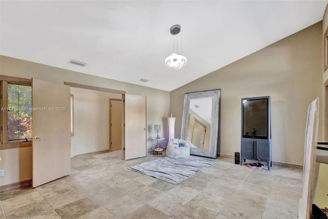 spare room featuring vaulted ceiling